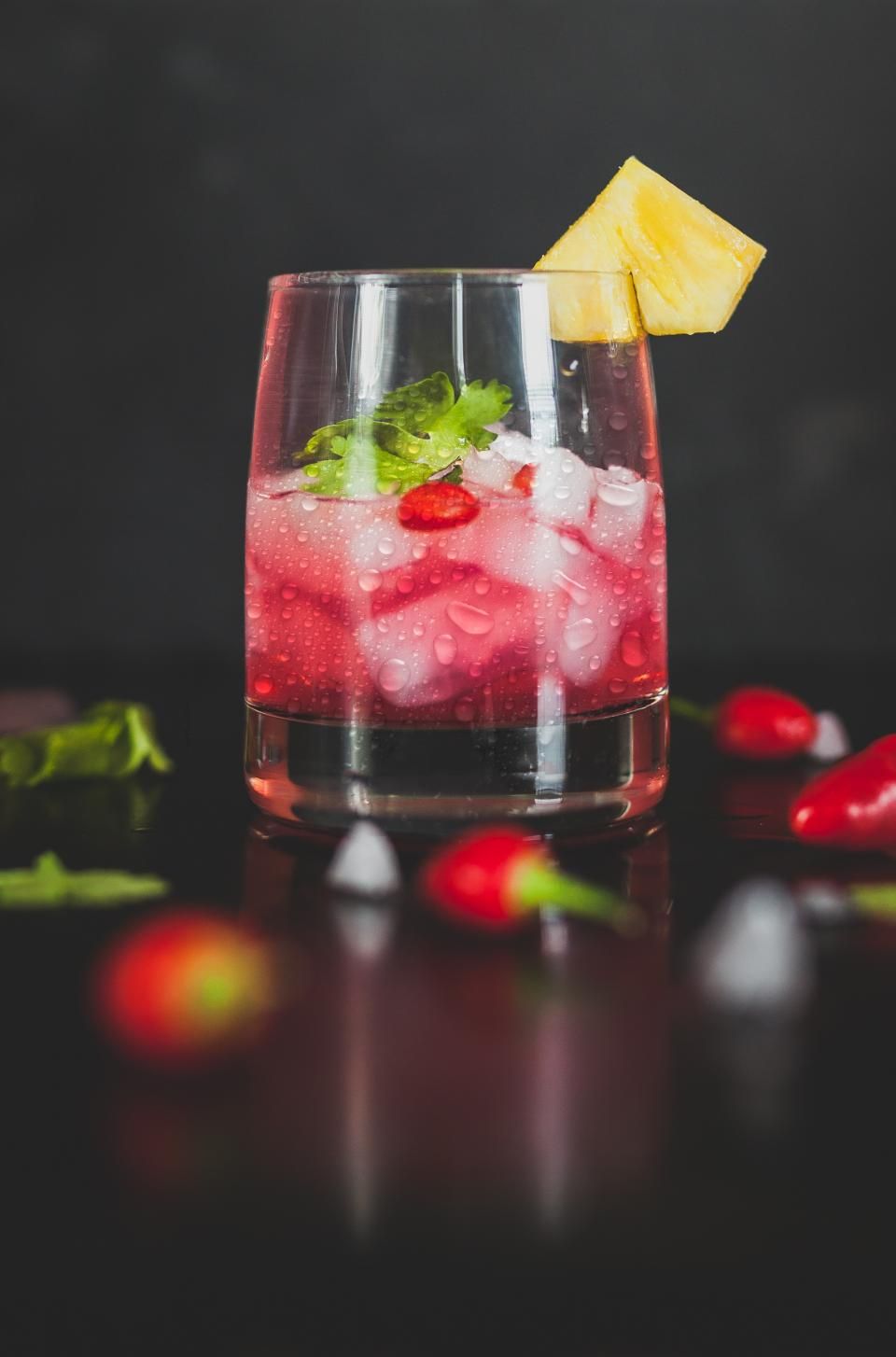 A cocktail being finished at the bar