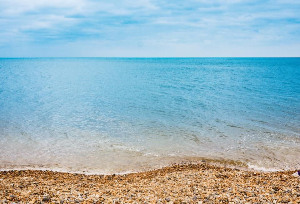 The beach and the water beyond it