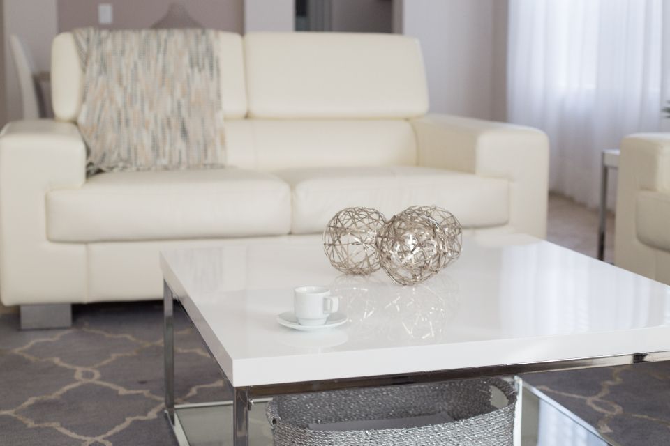 A suite sitting room with a sofa and armchairs